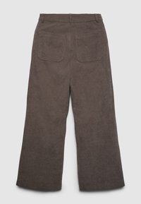 Pantaloni a gamba larga in velluto a coste di colore marrone tenue, con superficie strutturata e due tasche sul retro con cuciture dritte.