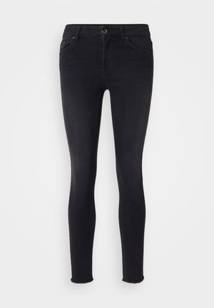 Svarte skinny jeans i denim materiale, med middels høy midje, frontlommer og råkant ved anklene. Klassisk femlommers design.
