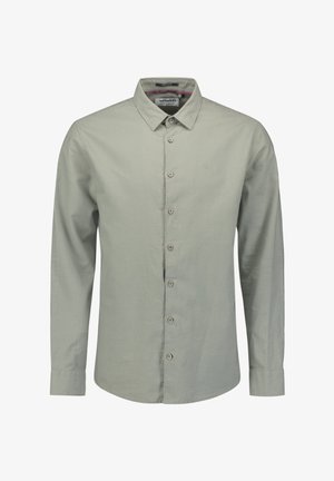 Lichtgroen lange mouwen shirt van zachte stof. Heeft een knoopsluiting aan de voorkant, een kraag en zes knopen met een subtiel logo op de borst.