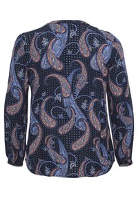 Námornícky dlhý rukáv blúzka s paisley vzorom v modrej a oranžovej farbe, s bodkovaným pozadím. Vyrobená z jemnej, ľahkej látky.