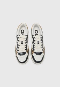 Sneakers with a white leather base, black accents, and leopard print details. Features padded tongues and laces. Flat rubber soles.
