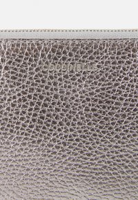 Metallic silver leather pouch with a textured surface, featuring a top zip closure and embossed brand logo, compact rectangular shape.