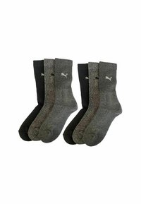 Set aus vier Knöchelsocken in Schwarz und Grautönen. Hergestellt aus einem strukturierten Material, mit dem weißen Puma-Logo an der Seite.