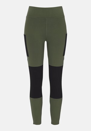 Olive green leggings with black side pockets and lower panels. Made from stretchy material, featuring a high waistband and fitted design.