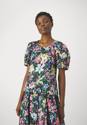 Floral print top with puff sleeves, featuring a round neckline. Colors include pink, blue, yellow on a black background. Textured fabric.