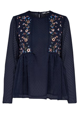 Granatowa bluzka z długim rękawem wykonana z przejrzystej tkaniny, z teksturowanymi kropkami i kwiatowym haftem na przednich panelach i ramionach.