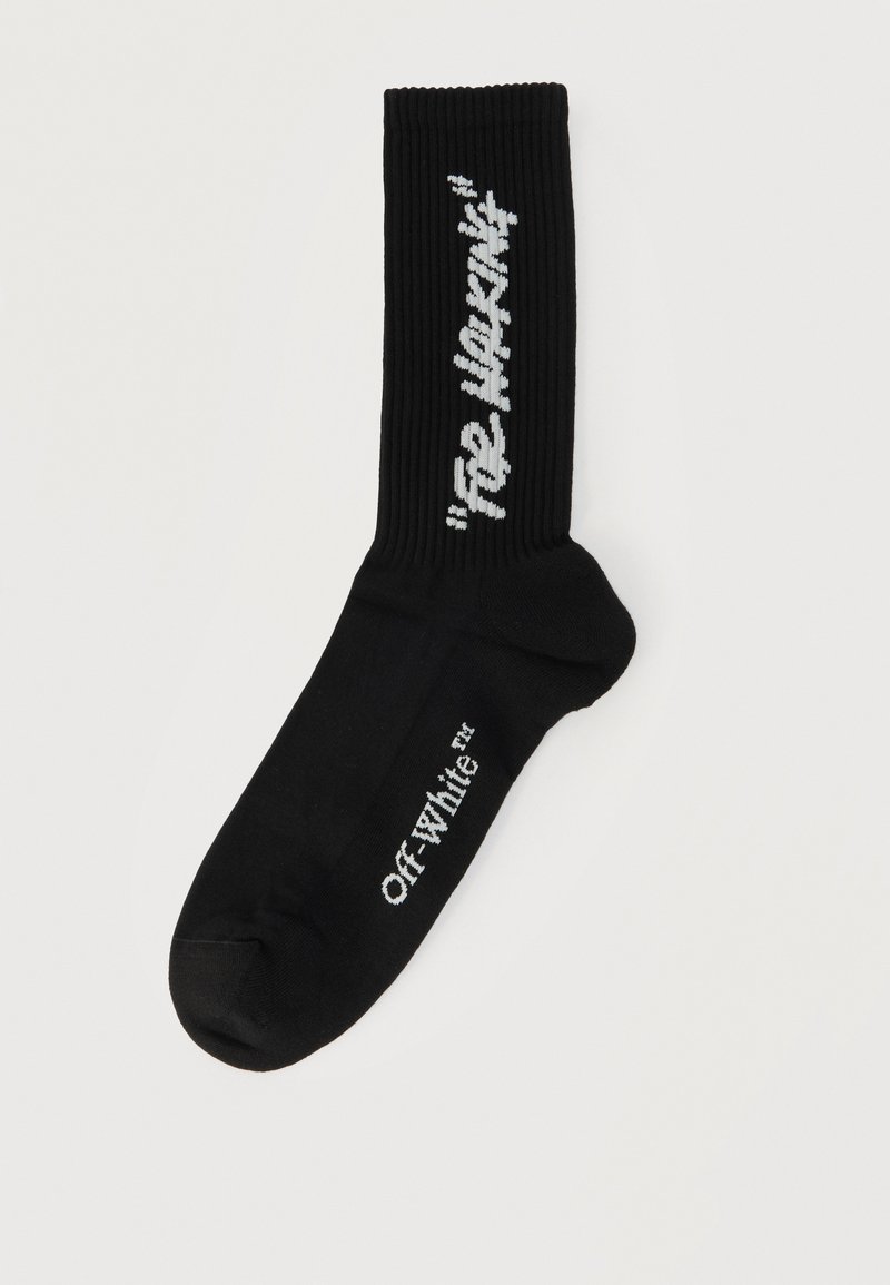 Chaussette noire à tige côtelée, logo blanc "Off-White" sur le pied et texte blanc "See Nothing" sur la zone du mollet.