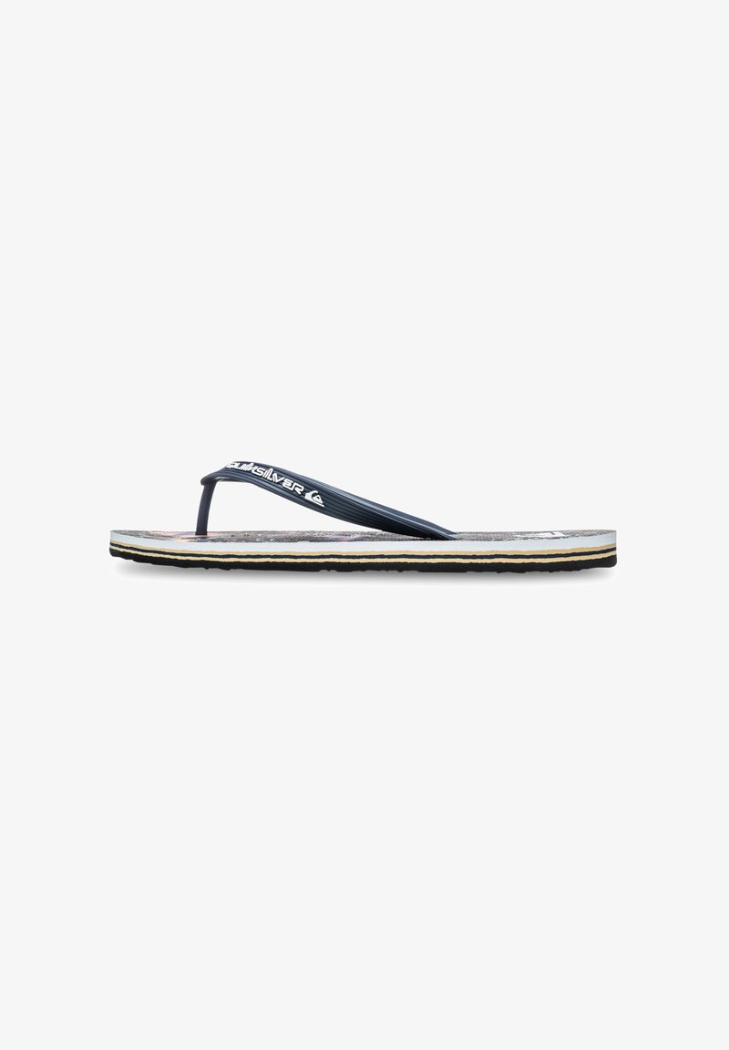 Single black and white flip-flop with textured sole and branded black strap, shown in side profile on white background.
