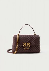 Brown quilted leather handbag with a gold swallow motif buckle, top handle, and detachable chain strap. Visible stitching detail.