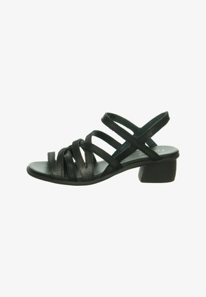 Black sandal with a low block heel, featuring multiple crisscross straps, a smooth leather texture, and an open toe design.