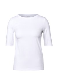 T-shirt blanc en tissu doux, avec des manches courtes, un col rond et un design épuré, simple, sans motifs ni accents.