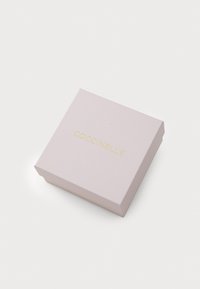 Coccinelle gift box, square shape, soft pink color, matte texture, features gold embossed logo on top.