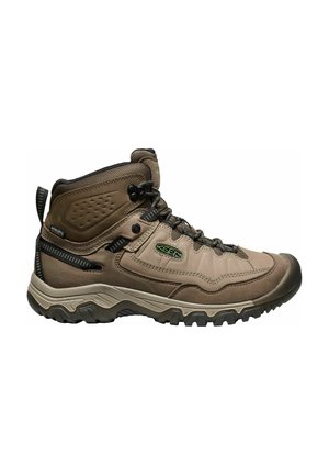 Brown hiking boot with high ankle support, durable material, textured surface, reinforced toe cap, and lacing system. Rubber outsole with grip.