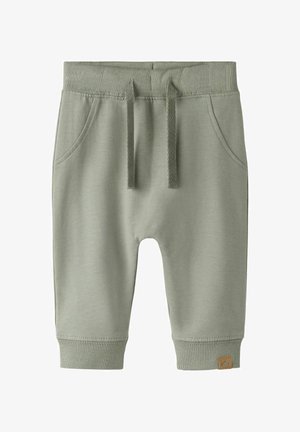 Lichte groene katoenen korte broek met een elastische tailleband, aantrekkoord, zijzakken en geribbelde boorden. Klein logolabel aan de onderkant rechts.