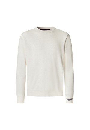 Stickad tröja med rund hals i off-white. Långa ärmar med ribbade muddar, med en mörklila logotypdetalj på vänster mudd. Mjuk textur.