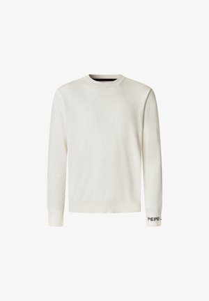 Pletene majica s crewneck izrezom v off-white barvi. Dolgi rokavi z rebrastimi manšetami, z temno vijoličastim logotipom na levem manšetu. Mehka tekstura.