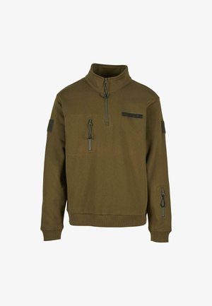 Olivgrön fleecepullover med kvartdragkedja, två dragkedjefickor och en ficka med kardborre på bröstet och ärmen.