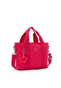 Borsa tote in tela rosa con manici doppi, tracolla regolabile e portachiavi a forma di scimmia in gomma. Presenta il logo sul lato anteriore e un tessuto texture.