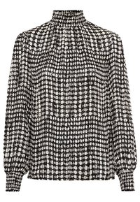 Blusa bianca e nera con colletto alto, texture arricciata e maniche lunghe a sbuffo. Presenta un motivo a pois e polsini elastici.