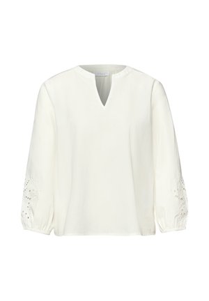 Biała bluzka z długim rękawem, dekoltem w kształcie litery V z wycięciem oraz elastycznymi mankietami, zdobiona kwiatowymi koronkowymi wycięciami na rękawach.