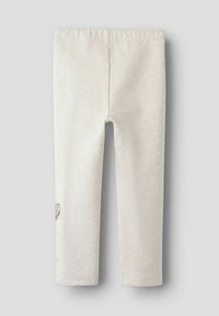 Leggings de color beige claro, hechos de tela suave, con una cómoda cinturilla elástica y un pequeño diseño de cucurucho de helado en la pierna.