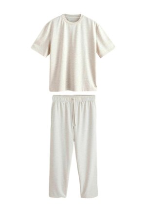 Világos bézs rövid ujjú póló és gumis derékú, húzózsinóros nadrág szett, fehér háttéren laposan elrendezve.