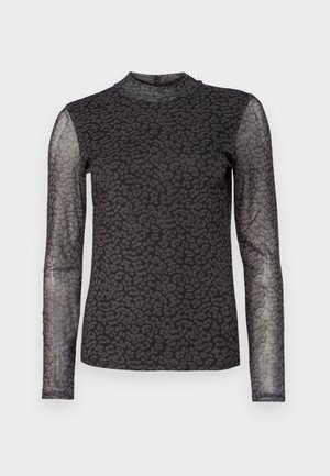 Dugi rukav majica s crnim poluprozirnim materijalom i uzorkom leopard krzna. Visoki izrez i pripijeni kroj. Teksturalni detalji na rukavima.