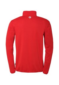 Rød fleecejakke med høj krave, lange ærmer og et cirkulært logo på den øverste del af ryggen. Glat tekstur uden mønstre.