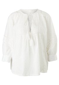 Blouse blanche à manches longues en tissu texturé à pois, avec liens à pompons à l'avant, bordure en dentelle, manches 3/4 froncées et coupe décontractée.
