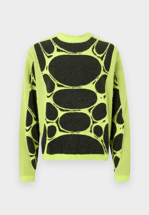 Πουλόβερ με μακριά μανίκια σε νέον κίτρινο χρώμα με μαύρο αφηρημένο οβάλ και στρογγυλό σχέδιο που καλύπτει το εμπρόσθιο μέρος και τα μανίκια.