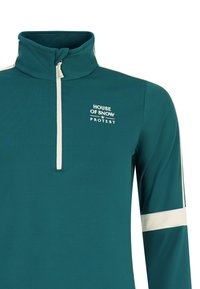 Žydros spalvos džemperis su pusiau užtrauktuku, balta logotipu ir peties juostomis. Pagamintas iš elastingos medžiagos, turi aukštą apykaklę ir prigludusį dizainą.