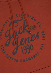 Maroon hoodie featuring a large circular graphic in dark blue text. The design includes "Jack Jones," "Fine Cotton Garments," and "Est. 1990."