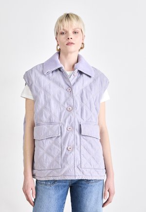 Quilted lavender vest with a large collar, two front pockets, and five buttons, paired with a white top and blue jeans.