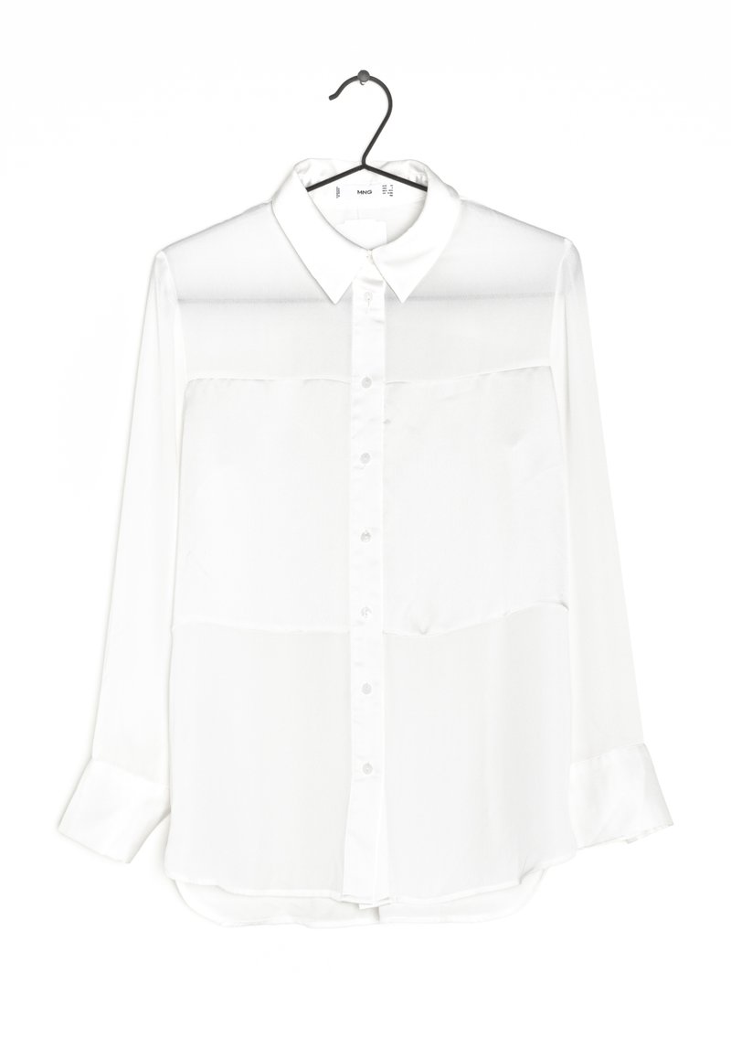 White long-sleeve shirt with a collared neck, button front, and sheer upper panels, featuring long sleeves with button cuffs and a slightly curved hem.