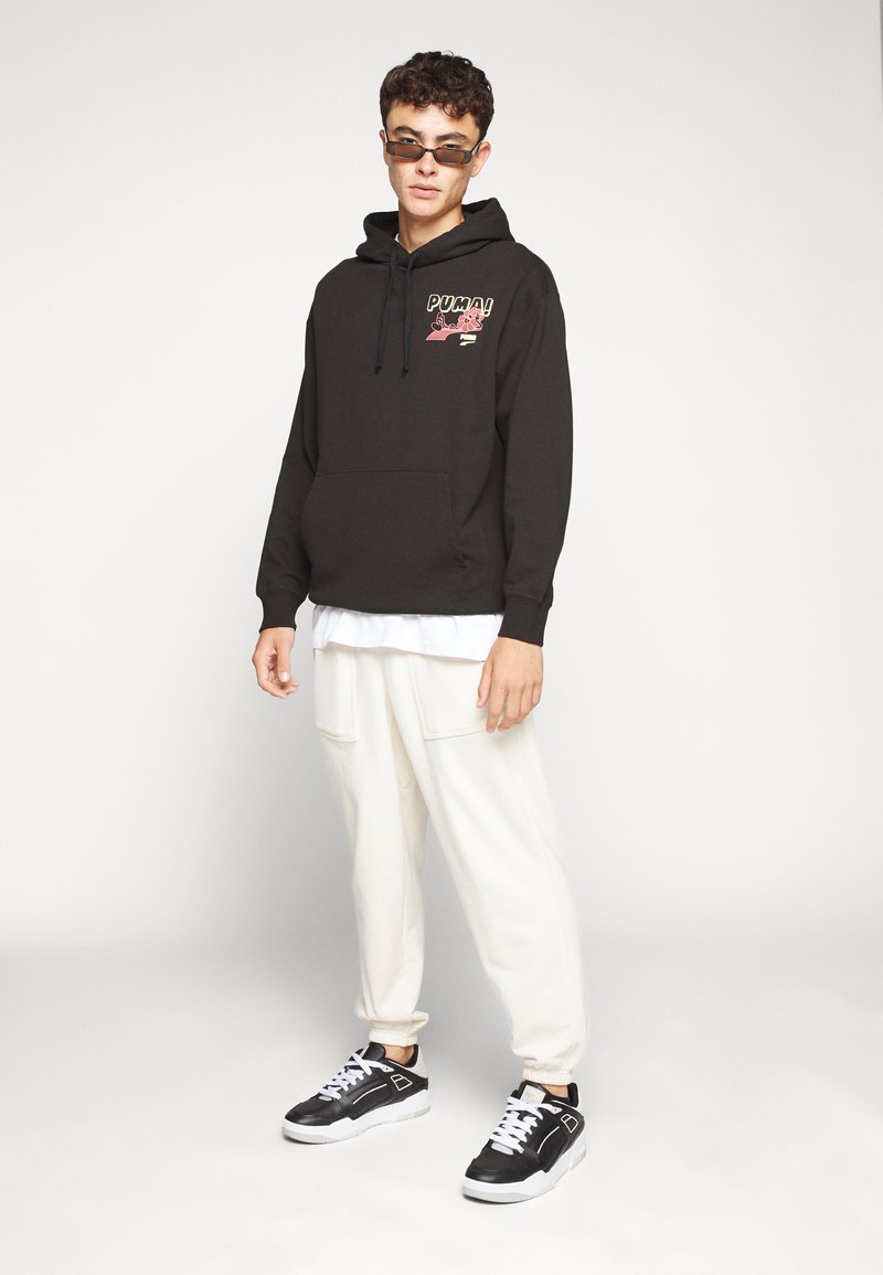 Puma DOWNTOWN GRAPHIC HOODIE - Sudadera - black/negro Zalando.es