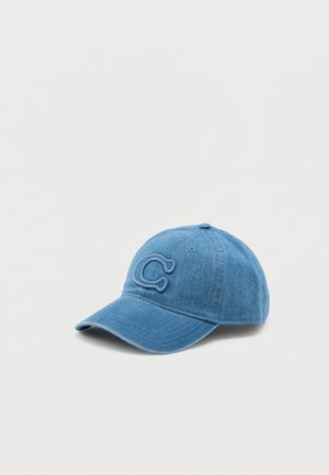 Denim sinine müts kõverate äärega, mille esiküljel on helesinise brodeeritud täht "C". Pehme kangas ja struktureeritud disain.