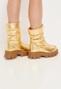 Cesare Gaspari Botas para la nieve - gold-coloured