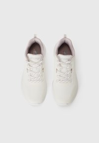 Pair of white Skechers athletic shoes with light beige inner lining and patterned laces on a white background.