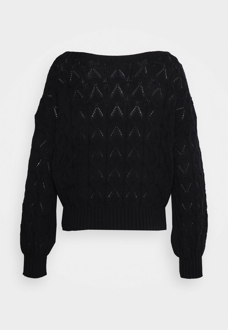Black knitted sweater featuring a textured pattern with diamond shapes, wide sleeves, and a cropped design. Ribbed cuffs and hem.