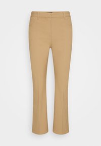 Beige ausgestellte Hosen aus einem glatten, dehnbaren Stoff. Verfügen über ein traditionelles Vier-Taschen-Design und einen Standardbund für eine enganliegende Passform.