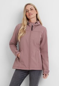 Light pink softshell jacket with a hood, front zipper, two side pockets, and adjustable drawstring. Smooth texture and fitted design.