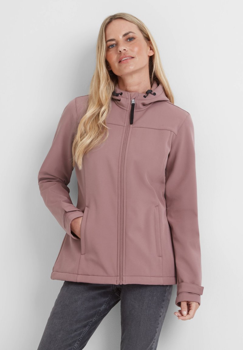 Light pink softshell jacket with a hood, front zipper, two side pockets, and adjustable drawstring. Smooth texture and fitted design.