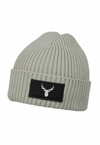 Light grey knit beanie with a ribbed texture, featuring a black patch displaying a white deer logo. Designed for warmth and comfort.