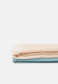 Three folded fabrics: soft, lightweight material. Top in light beige, middle in cream, bottom in soft blue. Smooth texture, no patterns.