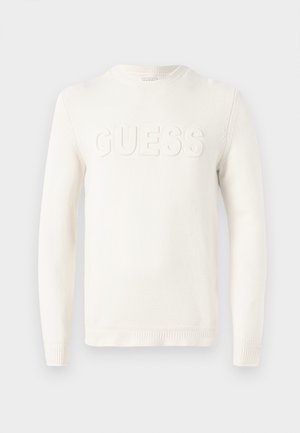 Suéter branco feito de um tecido de malha macia, com um decote redondo e a palavra "GUESS" em relevo na parte da frente. Punhos e bainha canelados.