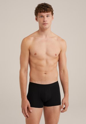 Boxers noirs en mélange de coton, offrant une coupe ajustée, une ceinture élastique et sans marque visible. Texture lisse et design simple.