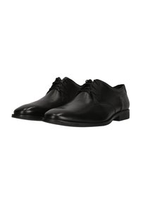 Chaussures de ville en cuir noir avec une surface lisse, un bout arrondi et un design à lacets. Elles présentent un talon bas et des accents de couture minimalistes.