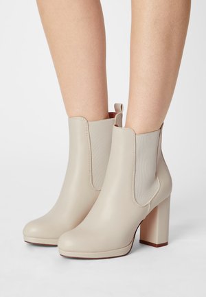 High heeled ankle boots - off-white