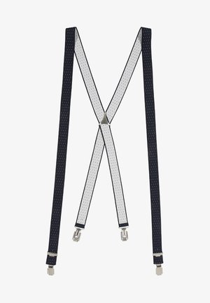 Bretelles réglables bleu marine et blanches avec un petit motif à pois et des clips métalliques argentés à chaque extrémité.