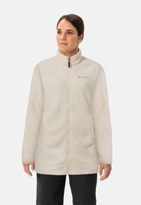 Fleecejacke in Off-White mit hohem Kragen, durchgehendem Reißverschluss und zwei seitlichen Taschen. Mit dezentem Logo-Stickerei auf der Brust.